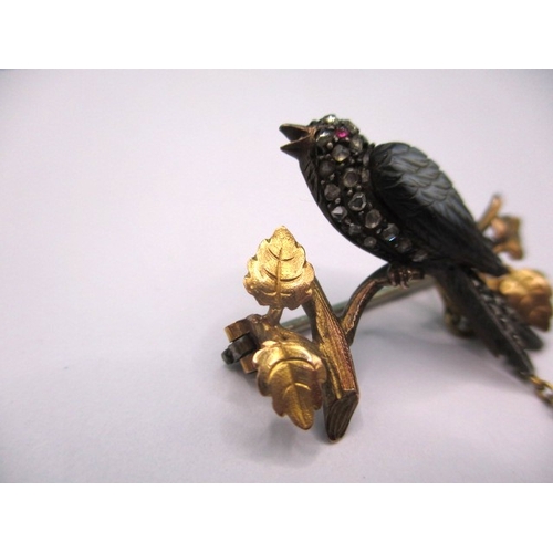 145 - An antique brooch of a song bird on a branch, yellow metal and gem set, electronically tested as dia... 