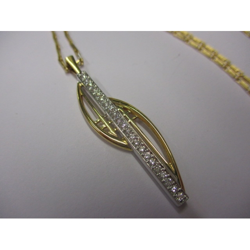 121 - A 750 yellow and white gold necklace and pendant with central row of diamonds, approx linear length ... 