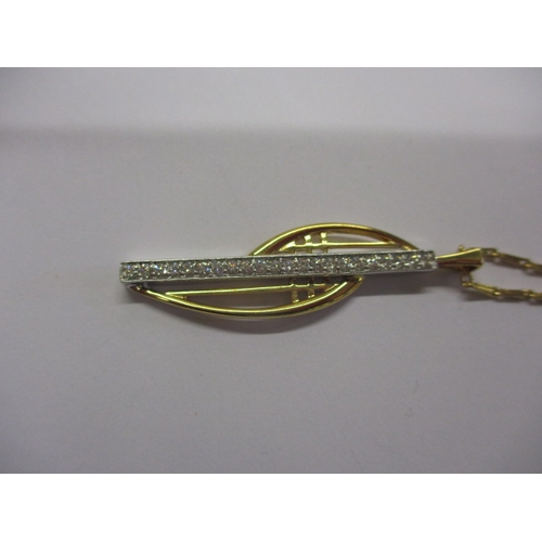 121 - A 750 yellow and white gold necklace and pendant with central row of diamonds, approx linear length ... 