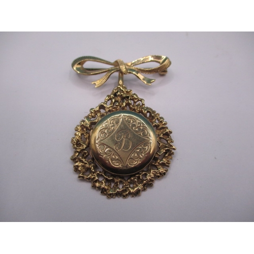 124 - A vintage 9ct yellow gold locket brooch/pendant, in useable pre-owned condition, approx weight 13.3g
