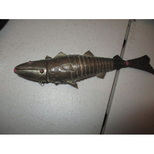 226 - A quantity of miscellanea to include 2 glass silver mounted jars, an articulate white metal fish and... 