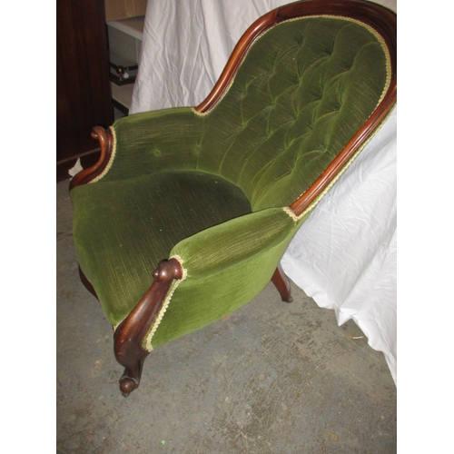 339 - A vintage green upholstered button back show wood parlour chair. In pre-owned condition with user re... 