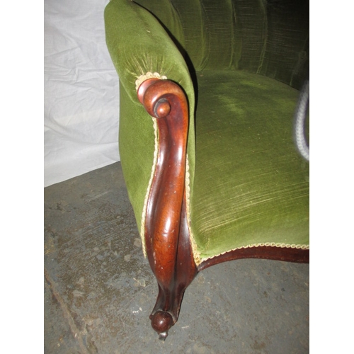 339 - A vintage green upholstered button back show wood parlour chair. In pre-owned condition with user re... 