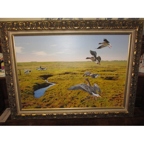 322 - A contemporary painting of pink feet geese over a Norfolk landscape, signed lower right, dated verso... 