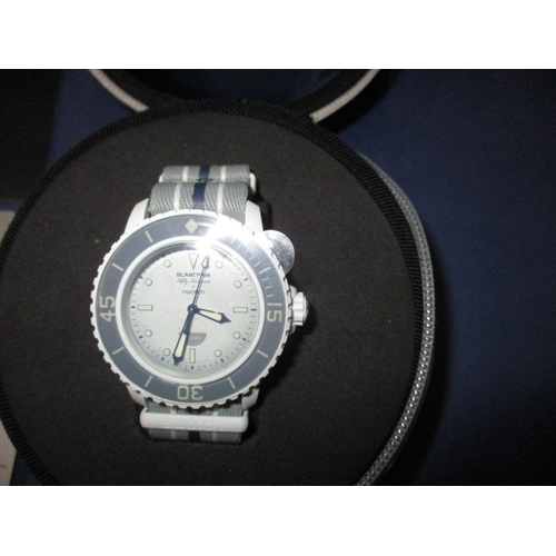 171 - A Blancpain X Swatch scuba watch, Antarctic ocean fifty fathoms in box with paperwork, automatic in ... 