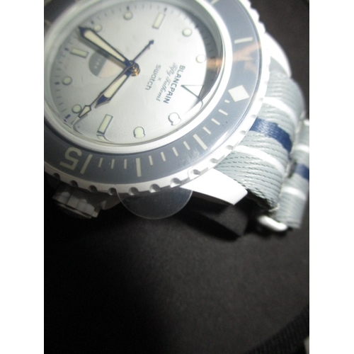 171 - A Blancpain X Swatch scuba watch, Antarctic ocean fifty fathoms in box with paperwork, automatic in ... 