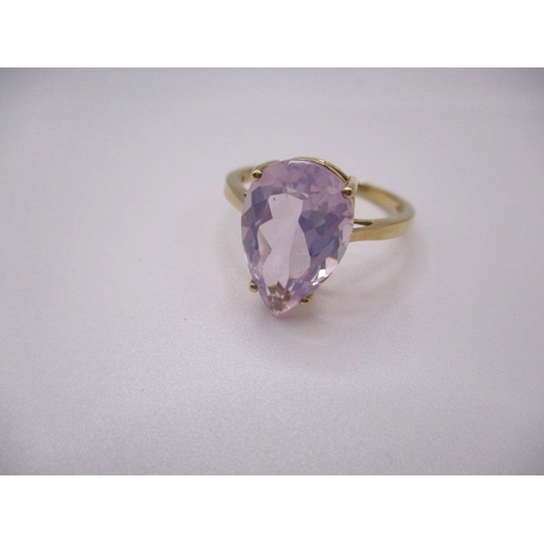 7 - A 10k yellow gold dress ring, with large pear shape Kunzite stone, approx ring size ‘S’, approx weig... 