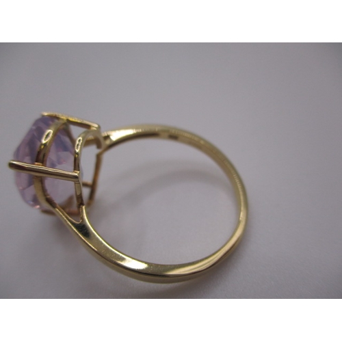 7 - A 10k yellow gold dress ring, with large pear shape Kunzite stone, approx ring size ‘S’, approx weig... 