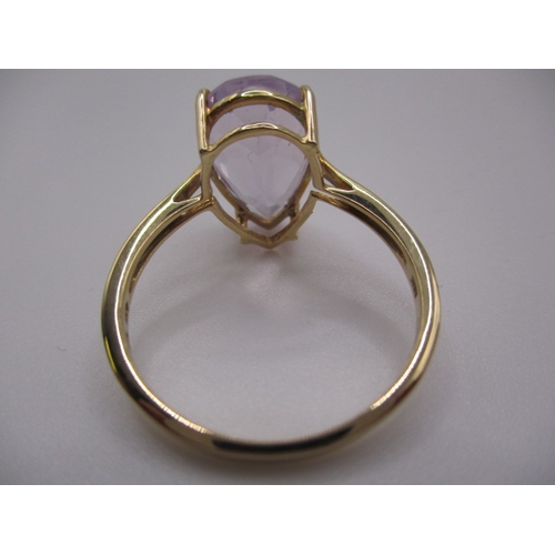 7 - A 10k yellow gold dress ring, with large pear shape Kunzite stone, approx ring size ‘S’, approx weig... 