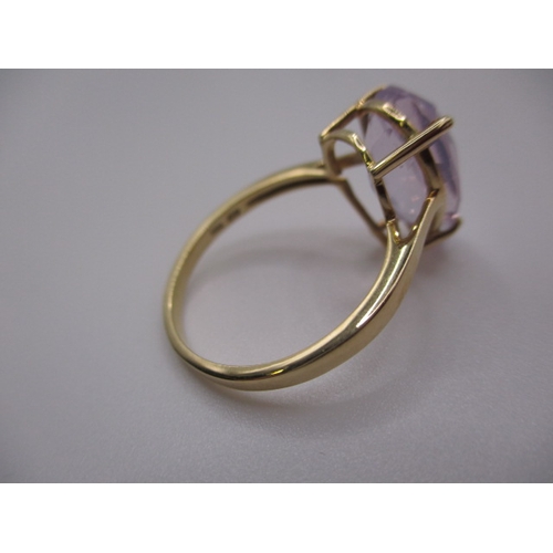 7 - A 10k yellow gold dress ring, with large pear shape Kunzite stone, approx ring size ‘S’, approx weig... 