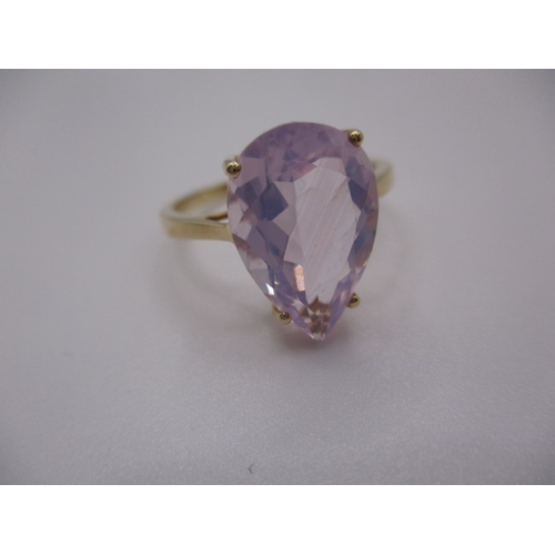 7 - A 10k yellow gold dress ring, with large pear shape Kunzite stone, approx ring size ‘S’, approx weig... 