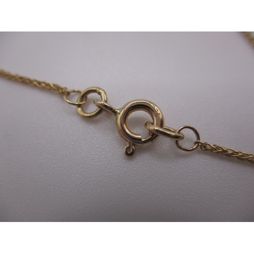 129 - A 9ct yellow gold necklace with peridot pendant, approx linear length 44cm, approx weight 2.7g, in u... 