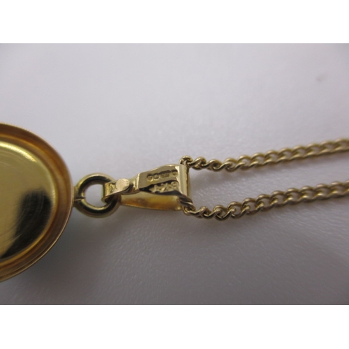 130 - A 9ct yellow gold necklace with turquoise pendant, approx linear length 44cm, in near unused conditi... 