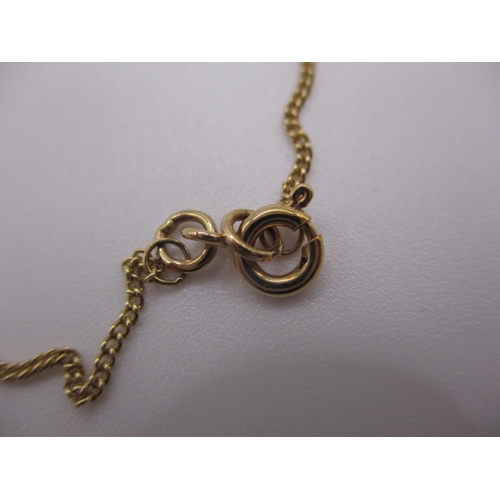 130 - A 9ct yellow gold necklace with turquoise pendant, approx linear length 44cm, in near unused conditi... 