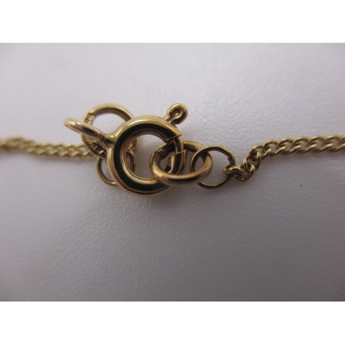 130 - A 9ct yellow gold necklace with turquoise pendant, approx linear length 44cm, in near unused conditi... 