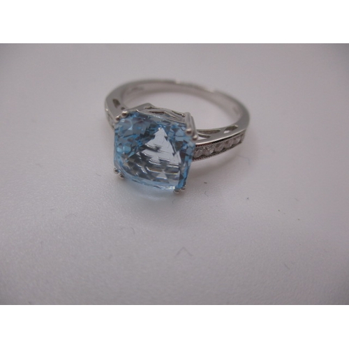 15 - An 18ct white gold diamond and aquamarine dress ring, in near unused condition, approx ring size ‘N’... 