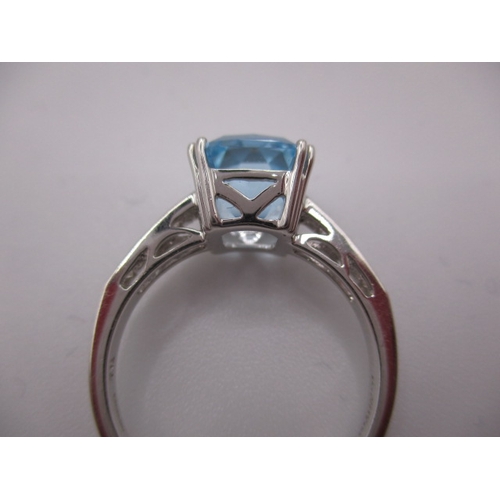 15 - An 18ct white gold diamond and aquamarine dress ring, in near unused condition, approx ring size ‘N’... 