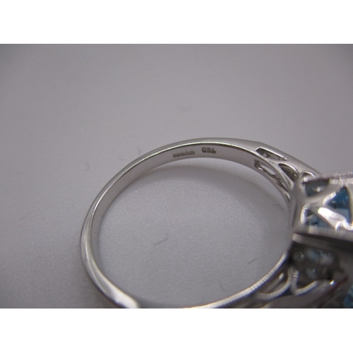 15 - An 18ct white gold diamond and aquamarine dress ring, in near unused condition, approx ring size ‘N’... 