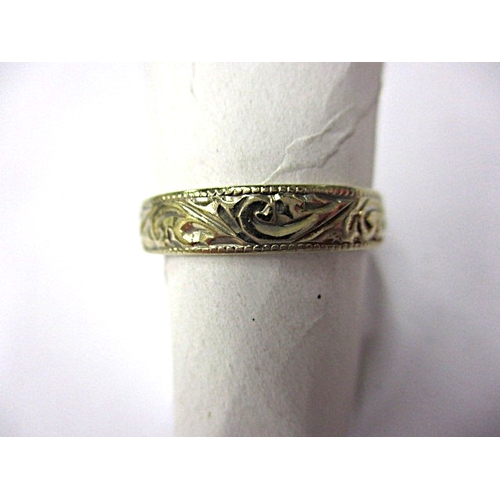 94 - A vintage 750 gold wedding band, approx ring size ‘L+’, approx width 3.8mm, approx weight 2g, in use... 