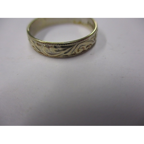 94 - A vintage 750 gold wedding band, approx ring size ‘L+’, approx width 3.8mm, approx weight 2g, in use... 