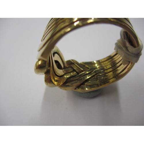 95 - A Saudi Arabian gold puzzle ring, comprising of 8 segments, in good pre-owned condition, approx ring... 