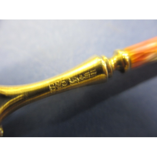 215 - A set of six 925 silver and enamel tea spoons, the pink one having the smallest sliver of enamel mis... 