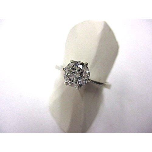 21 - An 18ct white gold diamond solitaire ring, the stone certificated as 1.02ct, approx ring size ‘N+’ a... 