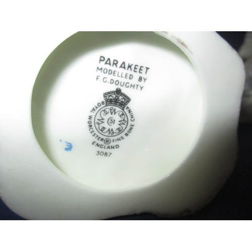 302 - Two vintage Worcester china figures, Parakeet and November, in pre-owned condition with no observed ... 