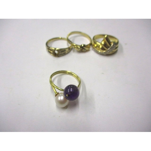 22 - An Indian yellow gold ring with white and purple beads, approx ring size ‘M’, approx weight 3.4g and... 
