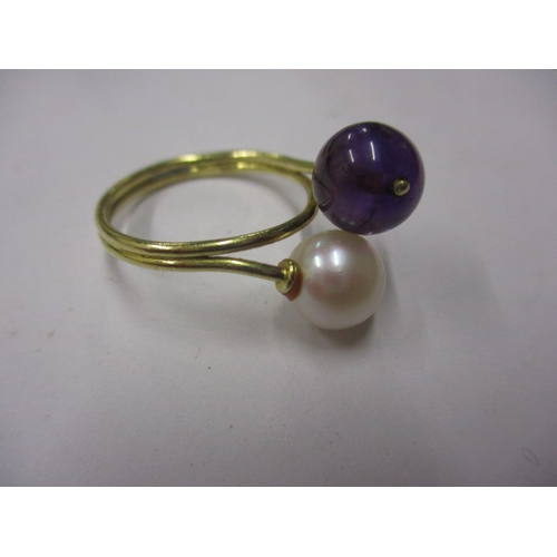 22 - An Indian yellow gold ring with white and purple beads, approx ring size ‘M’, approx weight 3.4g and... 