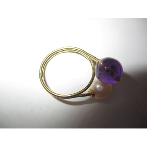 22 - An Indian yellow gold ring with white and purple beads, approx ring size ‘M’, approx weight 3.4g and... 