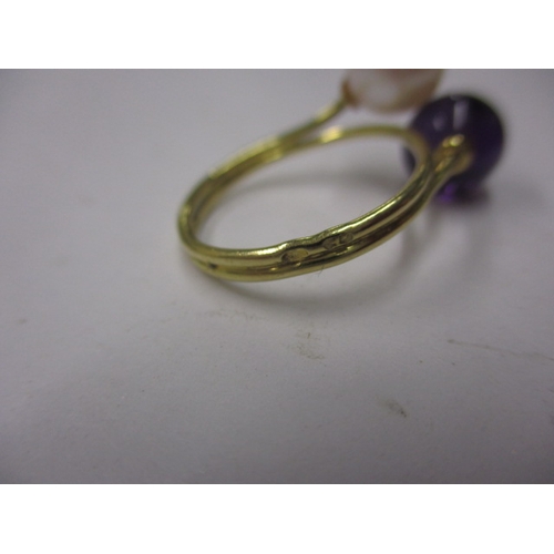 22 - An Indian yellow gold ring with white and purple beads, approx ring size ‘M’, approx weight 3.4g and... 