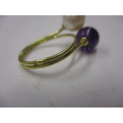 22 - An Indian yellow gold ring with white and purple beads, approx ring size ‘M’, approx weight 3.4g and... 