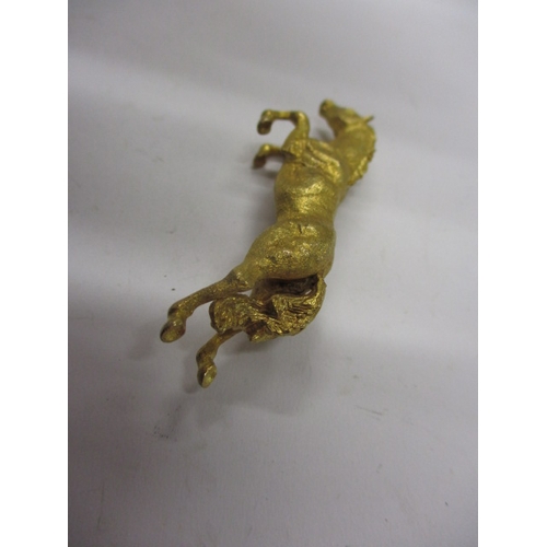 138 - A 9ct yellow gold brooch in the form of a running horse, approx weight 15.6g in useable pre-owned co... 