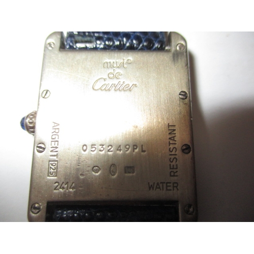 174 - A vintage silver cased Cartier tank watch, pre-owned with use related marks and not tested to functi... 