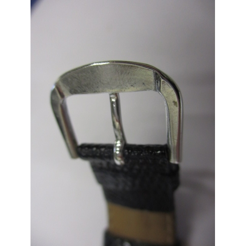 174 - A vintage silver cased Cartier tank watch, pre-owned with use related marks and not tested to functi... 