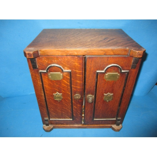 334 - An early 20th century oak smokers cabinet in the form of a bank safe, approx height 32cm, use relate... 