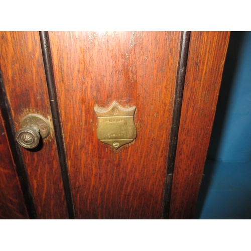 334 - An early 20th century oak smokers cabinet in the form of a bank safe, approx height 32cm, use relate... 