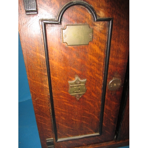 334 - An early 20th century oak smokers cabinet in the form of a bank safe, approx height 32cm, use relate... 