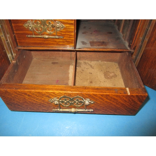 334 - An early 20th century oak smokers cabinet in the form of a bank safe, approx height 32cm, use relate... 