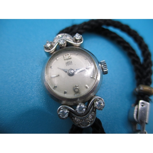 158 - A vintage ladies cocktail watch, the case marked 750 for white gold with diamond set shoulders, the ... 