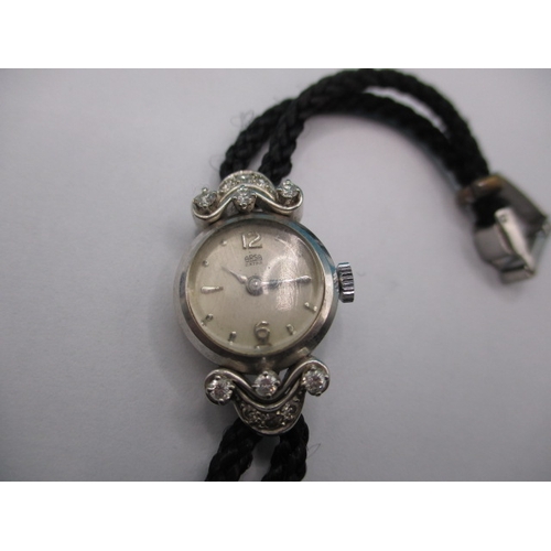 158 - A vintage ladies cocktail watch, the case marked 750 for white gold with diamond set shoulders, the ... 