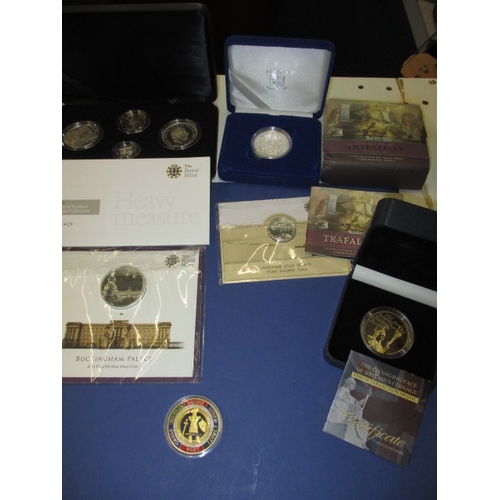 227 - A parcel of Royal mint special collectors coins, silver of various grades 925, 958 and 999, in prese... 