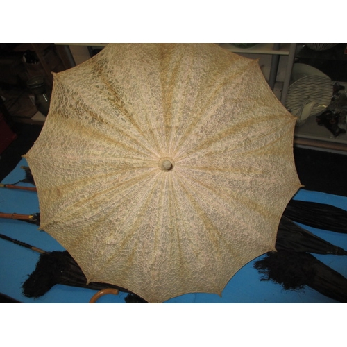 A parcel of antique and later parasols, all in used condition some with ...