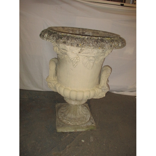 A very large Roman style garden urn on stand. Approximate height 97cm diameter 73cm, in useable weathered condition