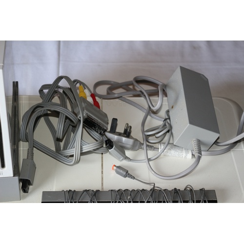 50 - Wii Console with Wires along with Wii Fit Board