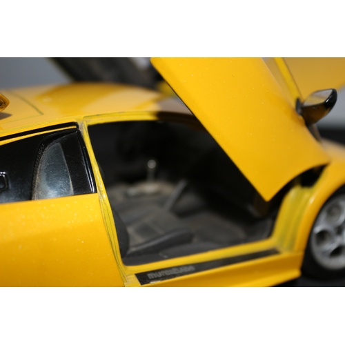 67 - 1:18 Die Cast Scale Model by Maisto of the Iconic Lamborghini Murchielago in Yellow.