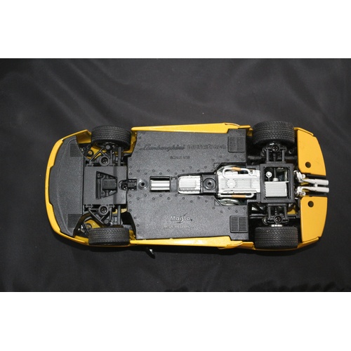 67 - 1:18 Die Cast Scale Model by Maisto of the Iconic Lamborghini Murchielago in Yellow.