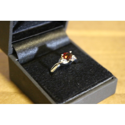 28 - Brand New Sterling Silver and Heart Shaped Garnet Ring - Size N. With Box and Tag