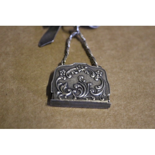 46 - Very Ornate Silver Coloured Metal - Deco Style - Bow with Hanging Handbag Brooch. The Bag Opens